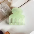 Green jelly hair claw clip detail shot, translucent resin material, compact daily accessory. - Light Green