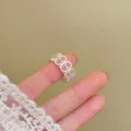 French hollow flower ring detail view, exquisite micro-paved rhinestones, adjustable open band. - Hollow Edge / Adjustable Open / Silver