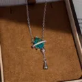 Detailed view of the sparkling blue zircon waterdrop necklace with delicate silver chain in box. - Water Drop Tassel Necklace (Lake Blue) / Silver