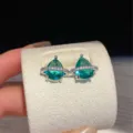 Elegant teardrop blue zirconia earrings with sparkling Saturn ring design for women fashion daily wear. - Saturn Stud Earrings (Lake Blue) / Silver
