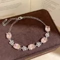 Exquisite pink cubic zirconia floral bracelet, elegant silver chain detail for women. - Silver/Pink