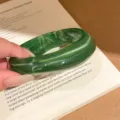 Dark green marble resin bangle detail shot showcasing unique swirling texture and trendy design. - Classic Round Bangle (3#)