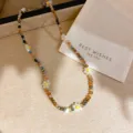 Detailed shot of colorful crystal beaded floral necklace with delicate daisy charms and shiny beads. - Coffee-White-Yellow (4#)
