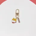 Close-up shot of the cute shiba inu dog alloy keychain pendant with handmade tag detail. - Akita Inu (1秋田犬)