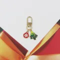 Close-up detail of Christmas tree and snowflake alloy keychain bag charm pendant accessory. - Christmas Tree And Snowball Style (4) / Red Green Gold