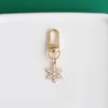 Gold metal lobster clasp keychain with a cute white enameled snowflake pendant for lovely bags. - Snowflake