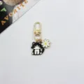 Cute alloy cat and daisy flower keychain, perfect metal bag charm and accessory for keys. - Black & White Cat