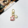 Cute metal cat keychain with daisy pendant, stylish gold bag charm and accessories for women. - Pink Striped Cat