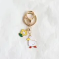 Cute duck and flower keychain detail, gold alloy bag charm and adorable cartoon pendant. - Style 1