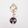Close-up detail of the metal alloy moon rabbit keychain featuring enamel drops and golden ring. - Rabbit Moon