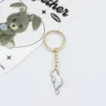 Cute lying cat keychain, gold metal charm pendant for bags and car keys. Detailed view. - White Cat Style (2121)