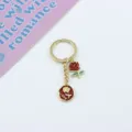 Exquisite gold-tone alloy keychain featuring red enamel rose and romantic love letter charms. - Red