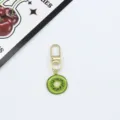 Detailed view of kiwi fruit slice alloy keychain and cute bag pendant charm with gold hook. - Kiwi Slice (2)