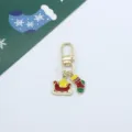 Detailed view of the Christmas alloy enamel keychain featuring a cute sleigh and stocking pendant. - Christmas Sled and Sock (4)