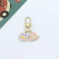 Cute cartoon marine animal keychain detail showing the shell pearl and pink octopus pendants. - Octopus