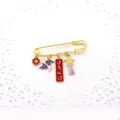 Gold safety pin brooch with cute enamel charms like pinwheel and blessing tag for students. - Red - Exam Blessing