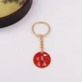 Metal keychain with a red round pendant, inspirational quote design, stylish gift accessory. - Live Youth to the Fullest