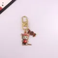 Cute Christmas cat candy keychain detail shot, alloy bag charm pendant accessory for holiday. - Style 3
