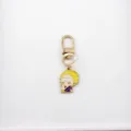 Detailed view of the cute celebrity scientist cartoon alloy keychain pendant for bags. - 3 Marie Curie