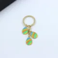Easter egg keychain with colorful enamel pendants gold tone metal cute holiday key ring accessory - Blue Orange Green Stripes