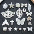 Detailed close-up view of assorted white pearl DIY handmade jewelry charms and beads. - Mixed Pendants (BE48) / 20 Pieces Set / Off White