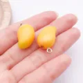 Resin mango charm pendant detail view, perfect for DIY handmade necklaces and bracelets accessories. - Resin Fruit 3D Mango (27849) / 1 Piece (23x14x10mm) / Yellow