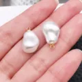 Close-up of baroque irregular white pearl pendant with gold bail for DIY jewelry making detail. - Baroque Shape (28650) / 1 Piece/Pack (18x11x9mm) / White