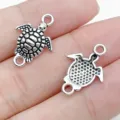 Silver turtle connector charms for DIY handmade bracelets, necklaces and jewelry accessories. - Ocean Sea Turtle Double Loop Connector (28855)