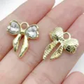 Gold alloy bow charm with clear rhinestones and textured design for DIY jewelry crafts. - White (Rhinestone Colorful)
