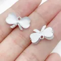 Silver four leaf clover pendant white stone rhinestone DIY jewelry making accessory - UV Dotted Rhinestone Peach Heart Bow Style (28459) / 1 Piece (10x17x6mm) / Silver