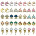 Close-up of assorted alloy rhinestone dolphin and jellyfish charms for DIY jewelry making. - Gold Marine Series Assortment (SN1806)