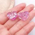 Ciondoli a cuore in resina rosa con glitter, perfetti per gioielli e portachiavi fai da te. - Cuore Glitterato / 1 Pezzo/Confezione (17x18x8mm) / Viola Trasparente
