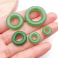 Green jade glass peace buckle loose beads detail view showing various sizes for diy jewelry. - Dark Green Lampwork Glass Ping'an Kou Donut Pendant (Large Hole)