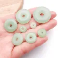 Detail view of light green imitation jade peace buckle beads for DIY jewelry making accessories. - 8mm - Hole 1.2mm - 0.3g / Green Murano Glass Ping'an Safety Buckles (Small Hole)