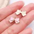 Jolis charms nœud rose en émail métallique pour fabrication de bijoux bracelets et colliers. - Nœud / 1 Pièce (15.5x10mm) / Rose