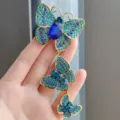 Blauer Kristall Schmetterling Brosche, elegante mehrschichtige Strass Anstecknadel Damen. - Dreifach Gliederschmetterling - Blau (XZ0325-1)