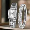 Vista dettagliata di orologio al quarzo geometrico da donna con bracciale di strass. - Orologio al quarzo rettangolare oro/nero + Set bracciale con strass (7) / Oro