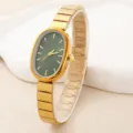 Elegant women's oval quartz watch with green dial and gold metal strap, chic fashion timepiece. - Green Dial Style (251218)