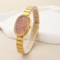 Detail view of minimalist oval quartz watch for women, elegant gold steel strap design. - Pink Dial Style (251218)