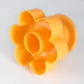 Orange plastic flower shaped hollow baking mold for making delicious cookies and cakes. - Plum Blossom Donut / Orange