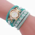Türkisfarbene Wickelarmbanduhr mit funkelnden Strasssteinen und Herz-Quarzzifferblatt Detail. - B3-Stil