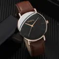Primo piano dettagliato di un elegante orologio al quarzo con un cinturino in pelle marrone. - Marrone