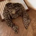 Detail view of a chic leopard print ribbon scarf, elegant thin neckerchief for stylish outfits. - Coffee Leopard Print Silk Scarf