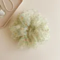 French style floral organza hair scrunchie detail view, elegant ponytail hair accessory. - Green