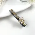 Detail view of elegant crystal rhinestone hair clip featuring sparkling champagne stones for women. - Plum Blossom Style in Champagne