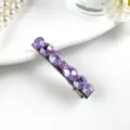 Exquisite purple crystal hair clip detail showcasing sparkling cut stones on metal base. - 1 Purple Style