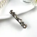 Detailed close-up of a vintage crystal barrette featuring multi-faceted K9 rhinestones. - Style 1 Grey