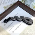 Detailed shot of rhinestone alloy hair clip, stylish black banana clip for chic daily hairstyles. - Style C Black Base Shiny Black