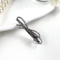 Close-up detail of a sparkling rhinestone bow hair clip, elegant crystal design for women. - Bestseller B