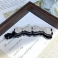 Alloy rhinestone hair clip detail view, elegant crystal bow design for charming ponytail styles. - Double Bow Ties with Black Base & Rhinestones